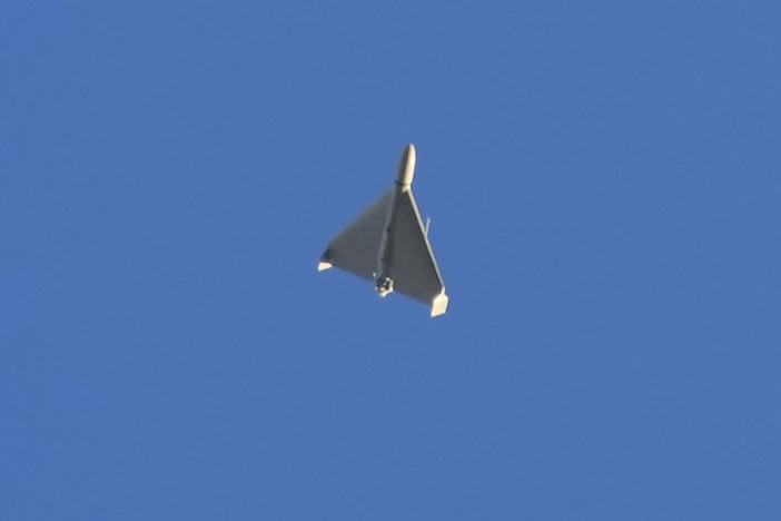 A drone is seen in the sky seconds before it fired on buildings in Kyiv, Ukraine, Monday, Oct. 17, 2022.