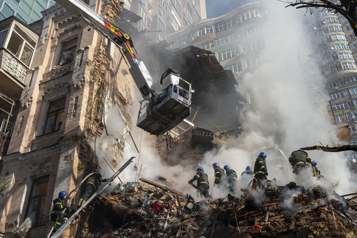 Firefighters work after a drone attack on buildings in Kyiv, Ukraine, Monday. It was the second Monday in a row of Russian strikes on the Ukrainian capital.