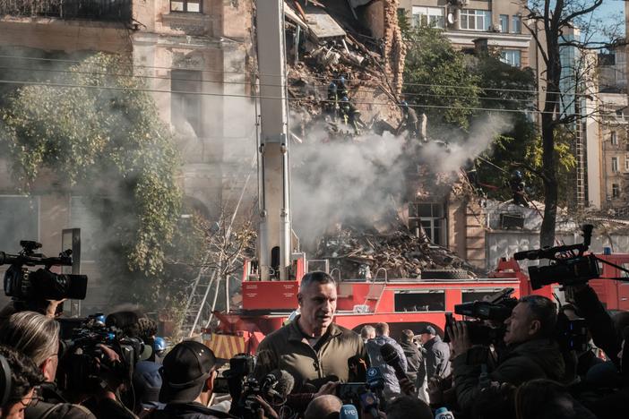 Kyiv Mayor Vitali Klitschko speaks to reporters in front of a building destroyed by a Russian drone strike Monday.
