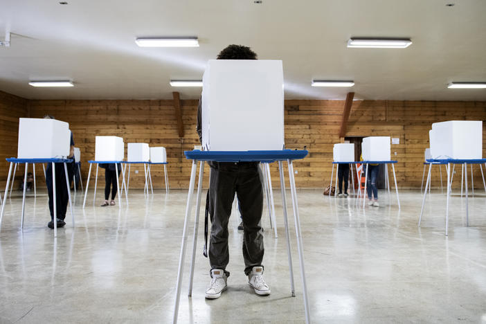 Voters fill out their ballots at the Gallatin County Fairgrounds in Bozeman, Mont., on Nov. 3, 2020.