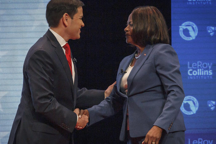 Republican U.S. Sen. Marco Rubio, and his Democratic challenger, U.S. Rep. Val Demings, greet each other before a televised debate at Duncan Theater on the campus of Palm Beach State College on Tuesday.