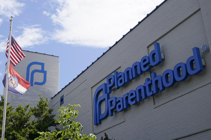 Missouri and American flags fly outside Planned Parenthood in June in St. Louis.