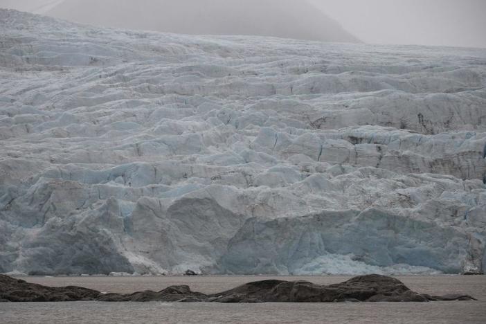 A view of Nordenskiold glacier melting and collapsing in the ocean in September 2021 in  Svalbard, a northern Norwegian archipelago.