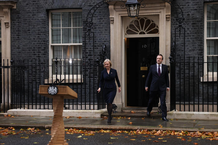 Prime Minister Liz Truss walks out of No.10 Downing St. to announce her resignation on Thursday in London.
