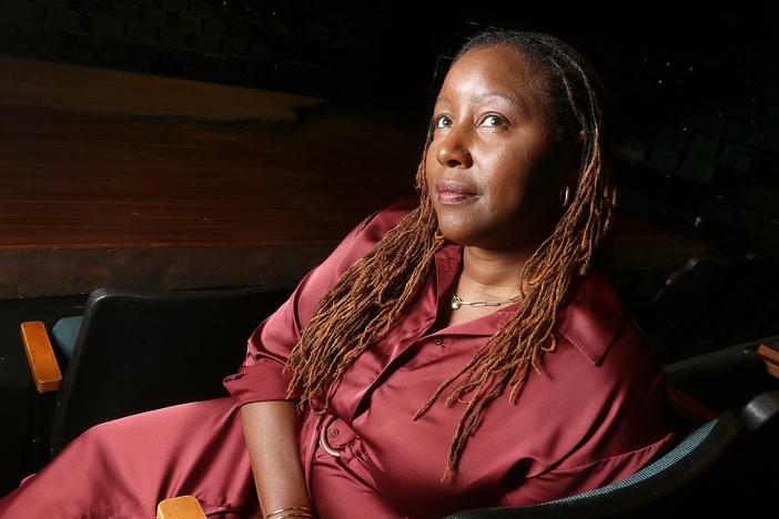 Oregon Shakespeare Festival Artistic Director Nataki Garrett sits inside the Thomas Theatre in Ashland, Ore.