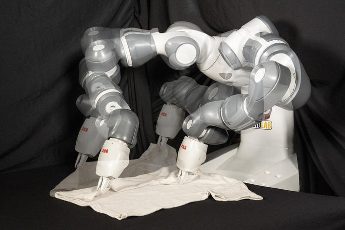 Most robots have not generally been equipped for the task of folding clothes. But an international group of researchers say their new method could change that — or at least speed up the process. Their robot is seen here in multiple exposures.