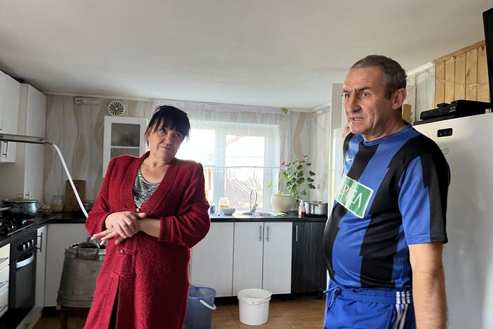Volodymyr and Svitlana Tsyba speak in their home in Hrushivka, Ukraine, on Oct. 18. They say they were detained by Ukrainian intelligence officials looking for Russian collaborators.