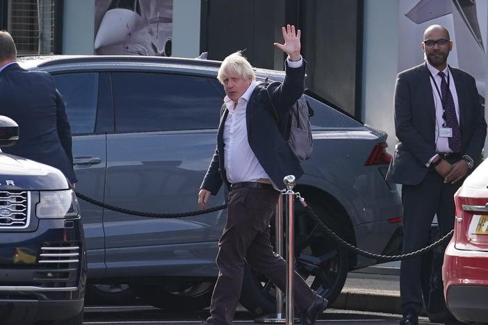 Former Prime Minister Boris Johnson arrives at Gatwick Airport in London on Saturday, after travelling on a flight from the Caribbean following the resignation of Liz Truss as prime minister.