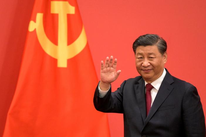 China's President Xi Jinping waves during the introduction of members of the Chinese Communist Party's new Politburo Standing Committee, the nation's top decision-making body, in Beijing on Sunday.