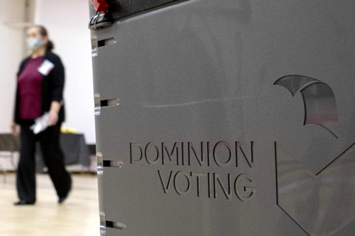 A Dominion Voting Systems ballot scanner is seen in this 2021 file photo. Election deniers have spread conspiracies about the Denver-based company's voting machines.