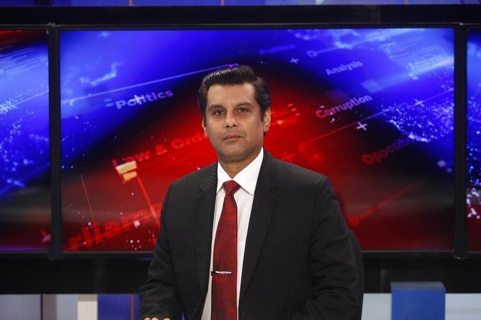 Senior Pakistani journalist Arshad Sharif poses in December 2016 for photograph prior to recoding an episode of his talk show at a studio in Islamabad.