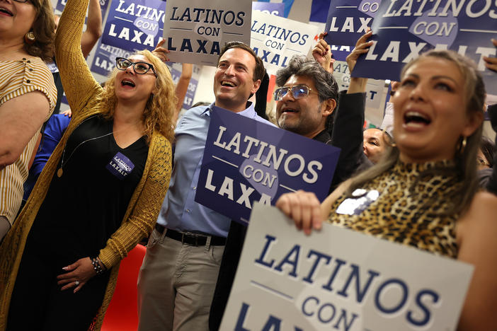 Nevada Republican U.S. Senate candidate Adam Laxalt (center) takes a group photo with supporters during a Hispanic Heritage Month Fiesta at the RNC Hispanic Community Center on Oct. 13, in Las Vegas. Republicans are making inroads to appeal to Latino voters.
