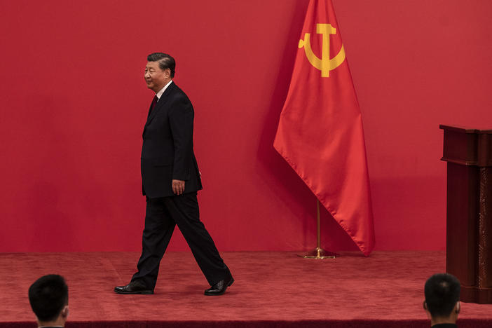 Chinese leader Xi Jinping leaves a press event with national and foreign journalists about the new Standing Committee of the Communist Party of China at The Great Hall of People in Beijing on Sunday.