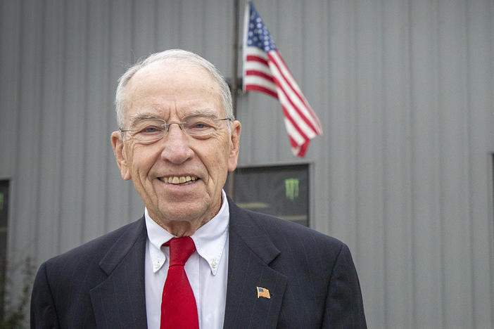 Iowa Republican U.S. Sen. Chuck Grassley poses for a photo outside Atlantic Coca Cola Bottling Co. in Walcott on Oct. 14.