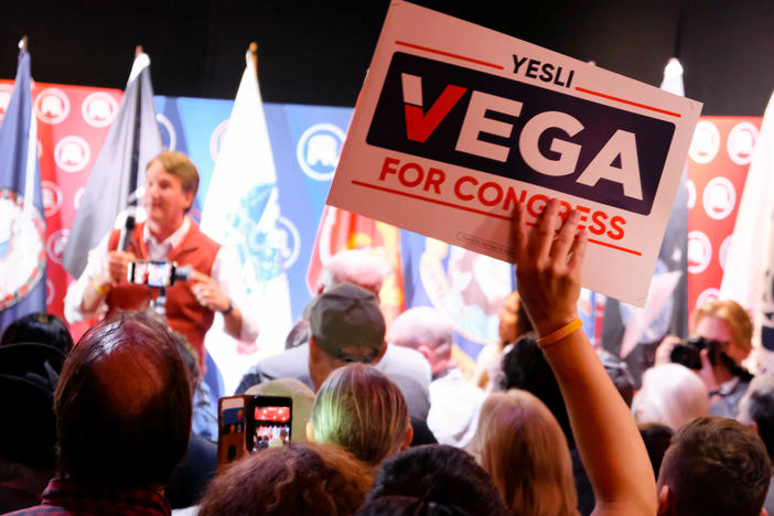 Virginia Gov. Glenn Youngkin campaigns for Republican congressional candidate Yesli Vega at a restaurant in Fredericksburg, Va. Youngkin noted Vega could make history by becoming Virginia's first Latino congressional representative.