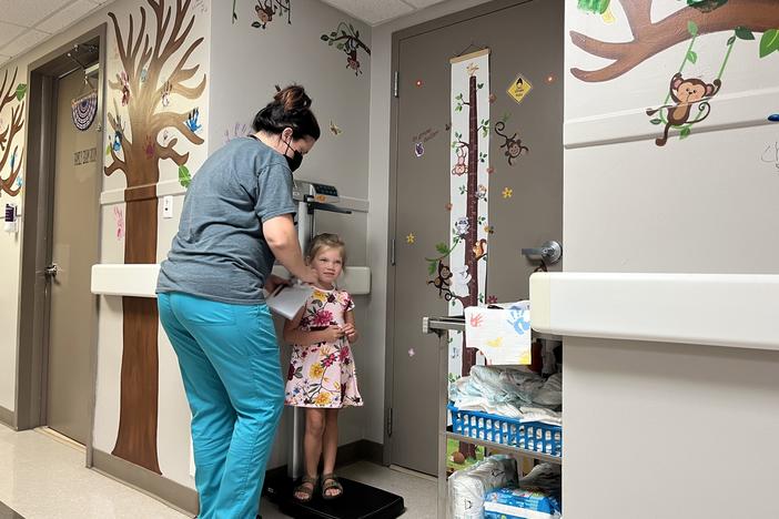 Khloe Tinker, 5, is measured ahead of an appointment at the Doniphan Family Clinic in Doniphan, Missouri. The clinic is the only source for specialized pediatric care in its rural Ozark county.