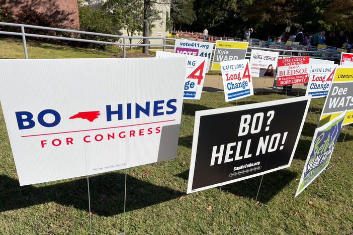 Election signs in Cary, N.C., a suburb of Raleigh that is part of a new congressional district in the state — an open seat that's a competitive race.