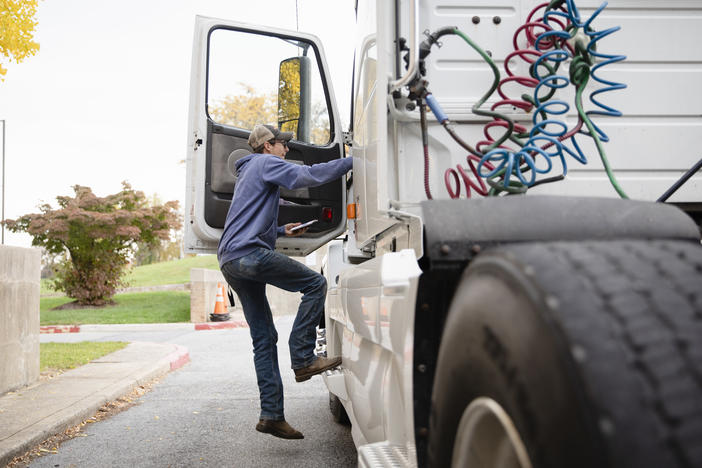 Tucker Bubacz, a 17-year-old senior, climbs into the cab of a semi truck just outside Williamsport High School in Williamsport, Md. on Monday, Oct. 17, 2022.