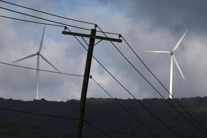 Turbines from the Roth Rock wind farm spin on the spine of Backbone Mountain near Oakland, Md., on August 23. The International Energy Agency says renewable energy projects are getting a boost of investment from governments around the world.