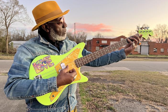 Jamaaladeen Tacuma in front of the Whiteville Bus Station