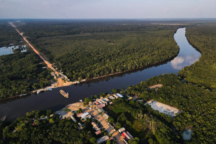 An aerial view of the BR-319 highway where it meets the Igapó Açu River in São Sebastião, Brazil, on Sept. 24. The community is a stopping point for travelers and tourists.