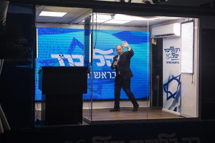 Former Israeli Prime Minister Benjamin Netanyahu speaks from a modified truck during a campaign event in Hadera, Israel, on Oct. 6. Israel will hold a national election Tuesday, after its coalition government collapsed in June.
