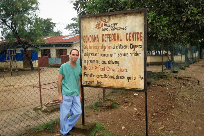 Dr. Benjamin Black in front of the Gondama Referral Center in Sierra Leone, where he worked during the Ebola outbreak of 2014-2016. The center treated children and women in urgent need of obstetric and gynecological care. As the outbreak exploded, the center decided to stop admitting pregnant women, a decision that still weighs on Black.