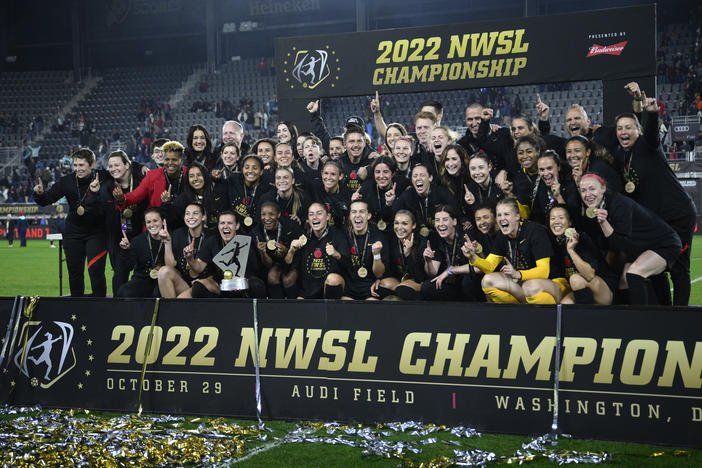 The Portland Thorns pose with the trophy after the team won the National Women's Soccer League championship match against the Kansas City Current on Saturday in Washington, D.C. Portland won 2-0.