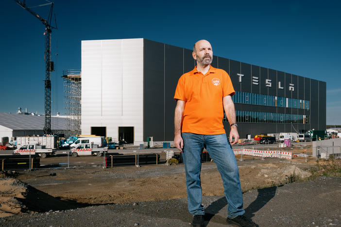 Local activist and politician Thomas Loeb, 55, in front of the Tesla factory in Gruenheide on Oct. 26. Loeb is concerned that the factory poses a risk to the groundwater, forest and wildlife around it, and that Tesla has not been transparent about its manufacturing processes and developments.