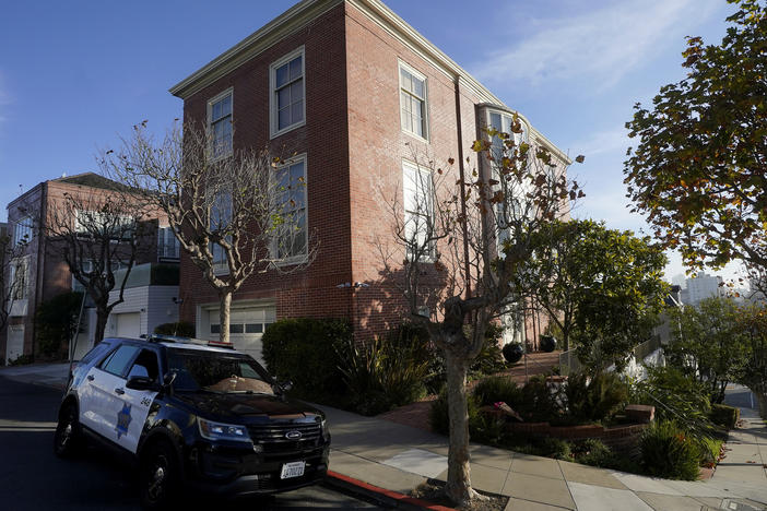 A police vehicle is parked outside the home of House Speaker Nancy Pelosi in San Francisco, on Saturday. Accused assailant David Wayne DePape faces felony charges — assault and attempted kidnapping of an immediate family member of a U.S. official — which could land him in prison for a maximum of 50 years.