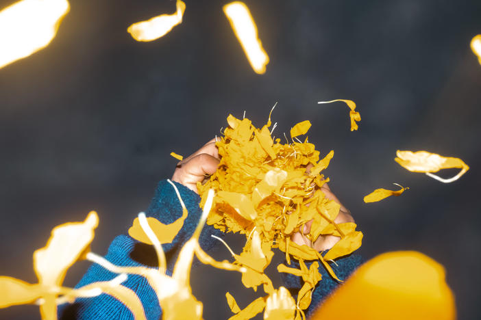 Alonso, the son of Maria Fernanda Hérnandez, plucks a cempasúchil flower in San Fúlix Hidalgo, Puebla, Mexico.