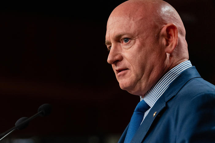 Sen. Mark Kelly, D-Ariz., speaks during a news conference in Washington in July.