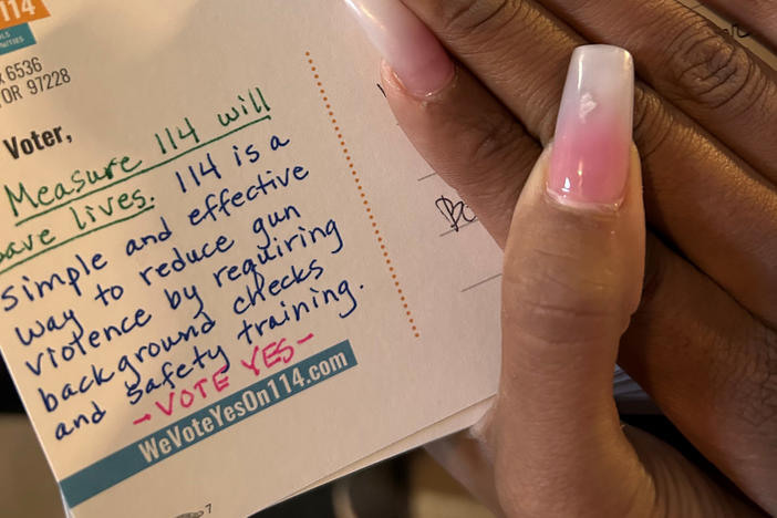 Volunteers working to pass an Oregon ballot measure that would require gun permits estimate they sent 10,000 handwritten postcards to voters in a period of a few days.