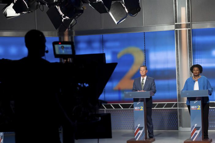 Republican Georgia Gov. Brian Kemp, left, and Democratic challenger Stacey Abrams face off in a televised debate, in Atlanta on Sunday.
