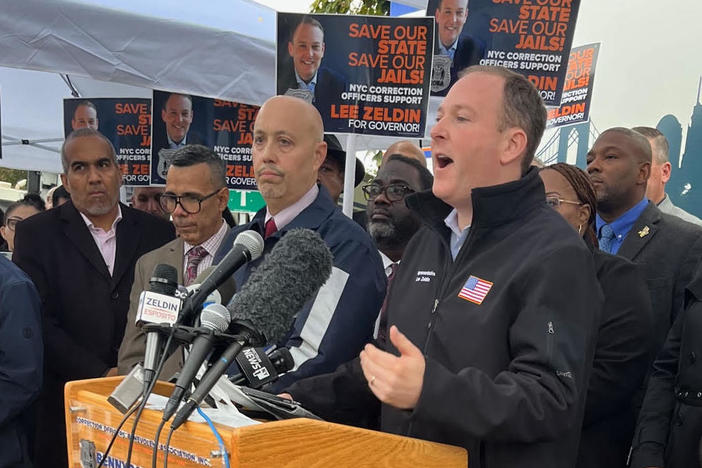 Republican congressman Lee Zeldin campaigns for governor outside Rikers Island jail in New York.