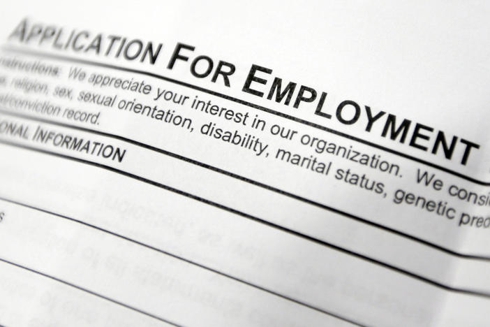 This April 22, 2014, file photo shows an employment application form on a table during a job fair at Columbia-Greene Community College in Hudson, N.Y.