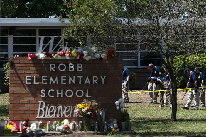 Investigators search for evidence outside Robb Elementary School in Uvalde, Texas, May 25, 2022, after an 18-year-old gunman killed 19 students and two teachers. Four months after the Robb Elementary School shooting, the Uvalde school district on Friday, Oct. 7 pulled its entire embattled campus police force off the job.