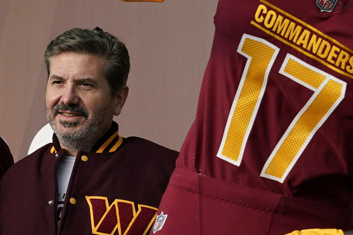 Washington Commanders owner Dan Snyder poses for photos during an event to unveil the NFL football team's new name on Feb. 2 in Landover, Md.