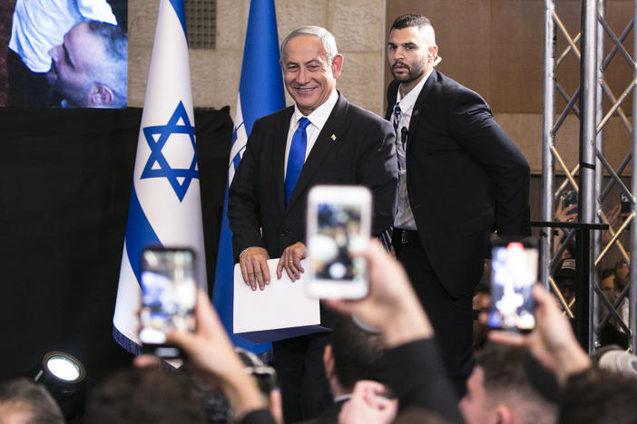 Likud leader Benjamin Netanyahu enters an election night event in Jerusalem on Monday.