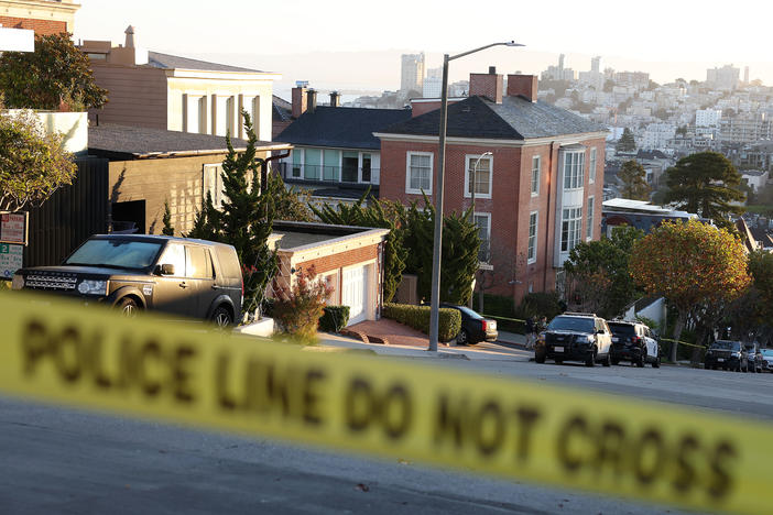 Police tape is seen in front of the home of House Speaker Nancy Pelosi and her husband, Paul Pelosi, on Friday in San Francisco. Paul Pelosi was violently attacked in their home by an intruder.