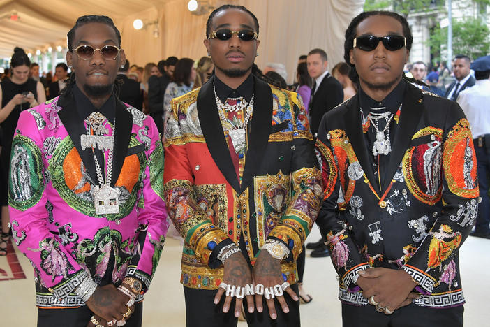 Rappers Offset (from left), Quavo and Takeoff of the group Migos appear at a Met gala in 2018. Kirshnik Khari Ball, known professionally as Takeoff, died early Tuesday morning after gunshots were fired at a party in Houston.
