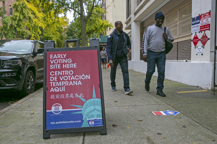 Signs indicate the location of an early voting polling site at Frank McCourt High School on the Upper West Side of Manhattan in New York City on Tuesday, November 1, 2022.