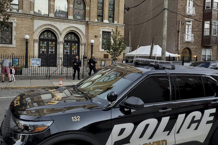 Hoboken Police officers stand watch outside the United Synagogue of Hoboken, Thursday, Nov. 3, 2022, in Hoboken, N.J. The FBI says it has received credible information about a threat to synagogues in New Jersey.