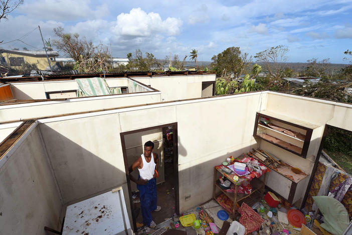 Uwen Garae surveys his damaged house in Port Vila, Vanuatu in the aftermath of Cyclone Pam in 2015. The country has been hit with two category 5 storms in the last 7 years.