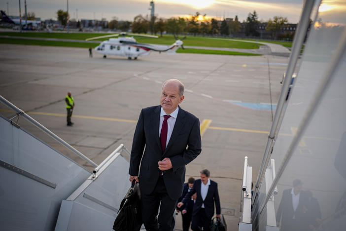German Chancellor Olaf Scholz arrives at Berlin-Brandenburg Airport for his flight to China on Thursday.
