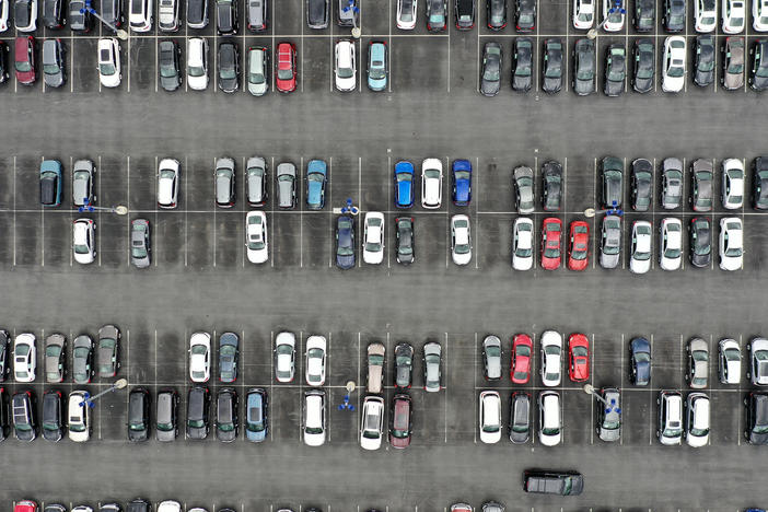 A CarMax lot holds hundreds of used cars and trucks  in Gaithersburg, Md. on April 12. Used car prices have fallen from their recent peaks, but they remain extraordinarily high compared to just a few years ago. And other costs of car ownership are rising, too.