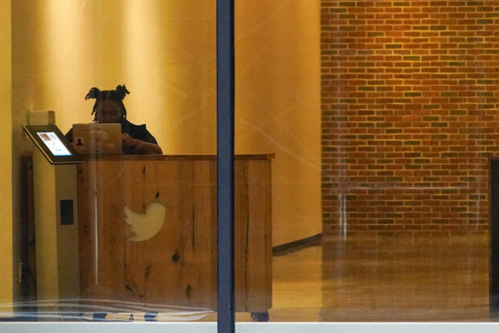 A receptionist works Oct. 26 in the lobby of the building that houses the Twitter office in New York.