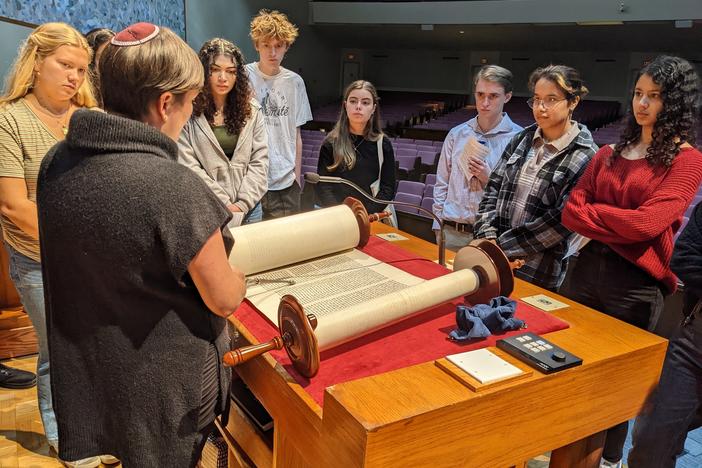 Rabbi Fischel shows a Torah scroll to American University students in October.