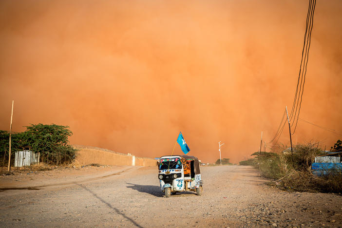 A tuktuk drives during a sandstorm in Somalia in April. The United Nations says a multi-year drought in East Africa is evidence of "mounting and ever-increasing climate risks."