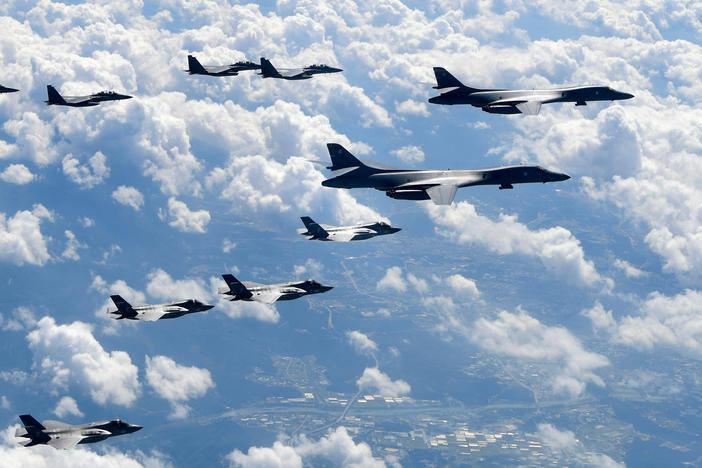 In this file photo provided by South Korea Defense Ministry, U.S. Air Force B-1B bombers, F-35B stealth fighter jets and South Korean F-15K fighter jets fly over the Korean Peninsula during joint drills on Sept. 18, 2017.